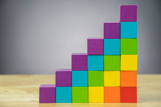 istock colorful stack of wood cube building blocks on black background 859036516