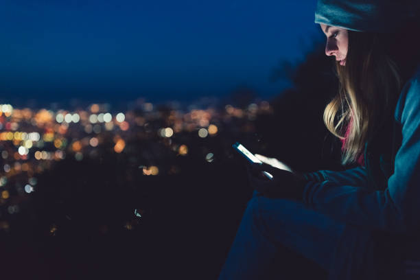 istock Young woman text messaging outside 859037344