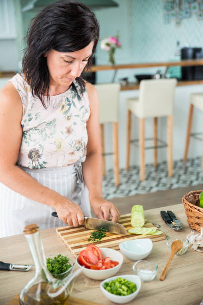 istock woman preparing a gazpacho 859040684