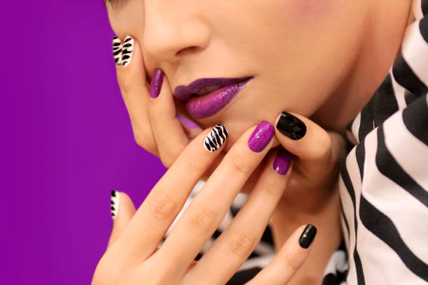 istock Black white striped manicure and makeup. 859043248