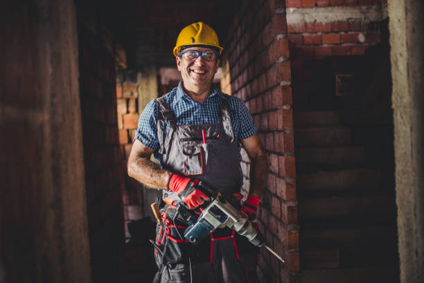 istock Portrait of a man on construction site with drill 859043588