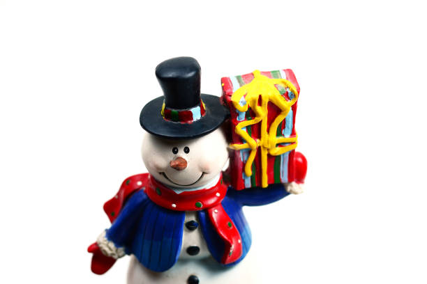 istock snowman with gift box on white background isolated 859044182