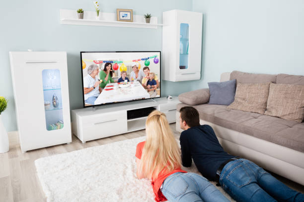 istock Young Couple Watching Movie On Television 859044304