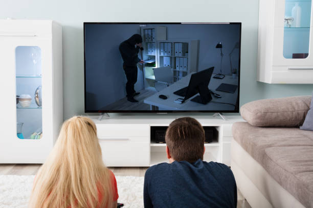istock Couple Watching Suspense Movie On Television 859044308