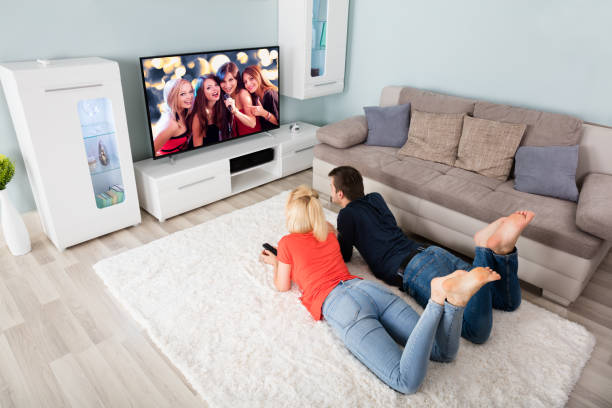 istock Couple Watching Television At Home 859046512