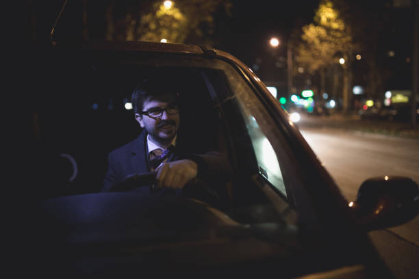 istock Man in a car at night 859058306