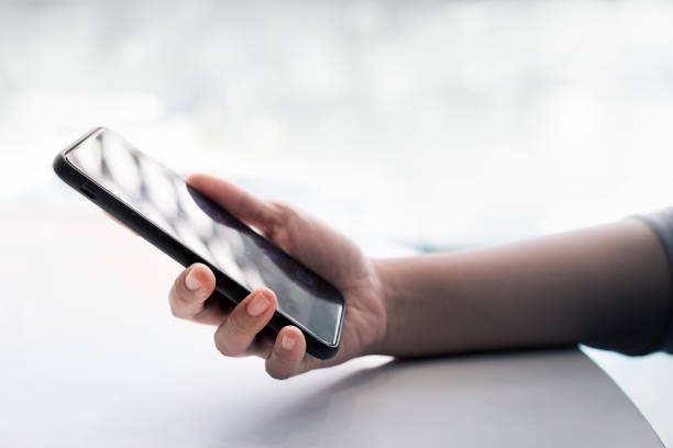 istock Female hand  holding smartphone 859062772