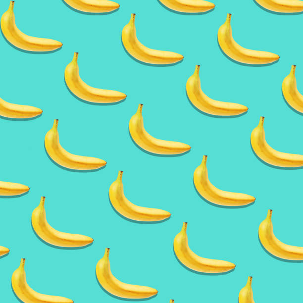 istock Banana slice pattern on pastel pink background. Minimal fruit concept. 859072052