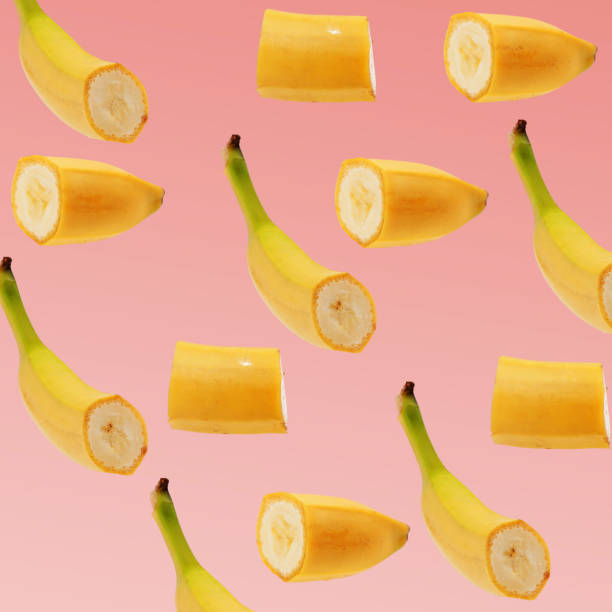 istock Banana slice pattern on pastel pink background. Minimal fruit concept. 859072122