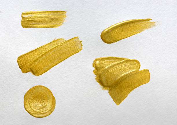 istock Gold paint stokes on white watercolor paper background 859073698