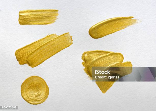 Gold Paint Stokes On White Watercolor Paper Background Stock Photo - Download Image Now