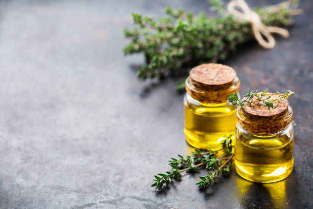 istock Organic essential thyme oil with green leaves 859073910