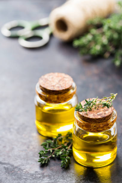 istock Organic essential thyme oil with green leaves 859074106