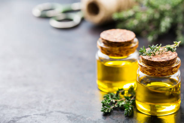 istock Organic essential thyme oil with green leaves 859074152