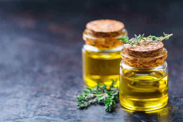 istock Organic essential thyme oil with green leaves 859074228
