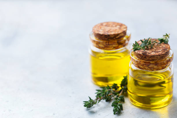 istock Organic essential thyme oil with green leaves 859074438