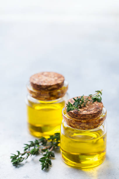 istock Organic essential thyme oil with green leaves 859075032