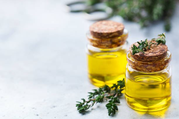 istock Organic essential thyme oil with green leaves 859076654