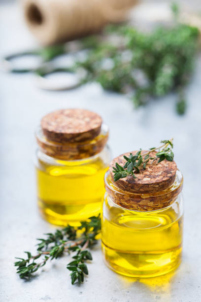 istock Organic essential thyme oil with green leaves 859076688