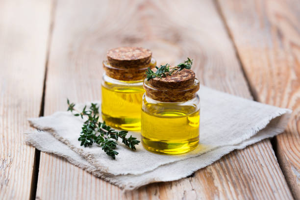 istock Organic essential thyme oil with green leaves 859076748