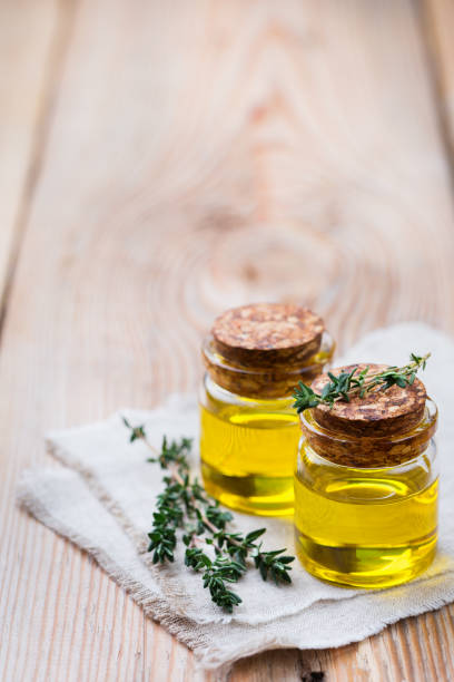 istock Organic essential thyme oil with green leaves 859076834
