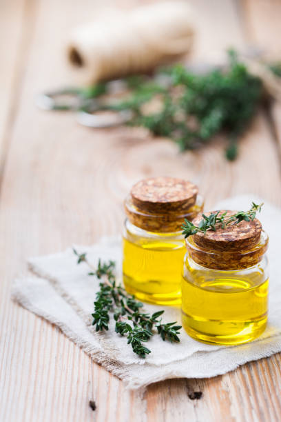 istock Organic essential thyme oil with green leaves 859076862