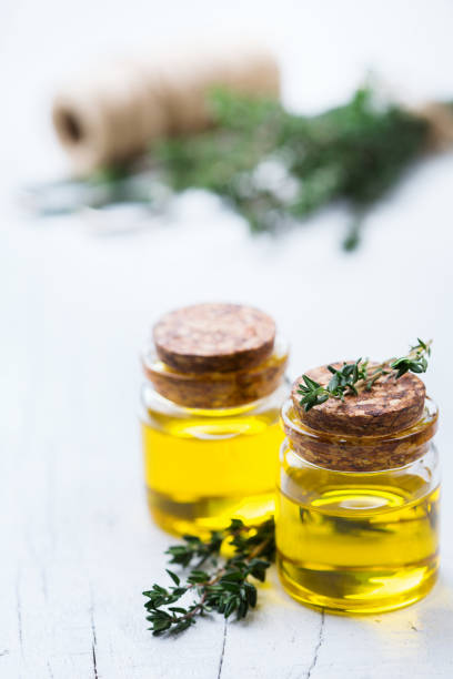 istock Organic essential thyme oil with green leaves 859077064