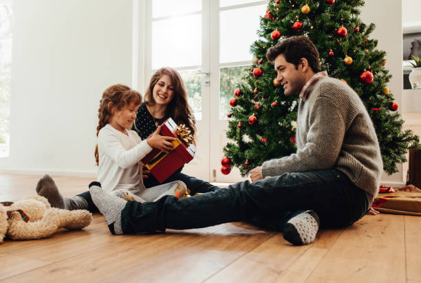 istock Family celebrating Christmas at home. 859077070