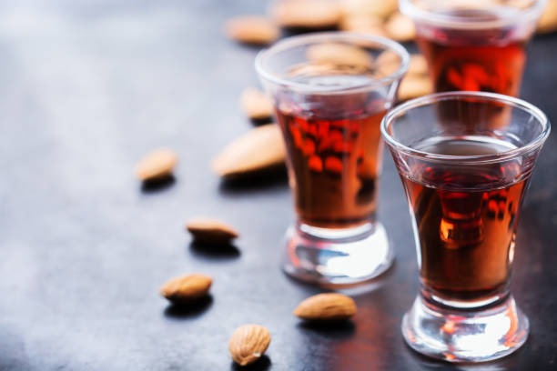 istock Almond liquor amaretto on a grunge black table 859077172