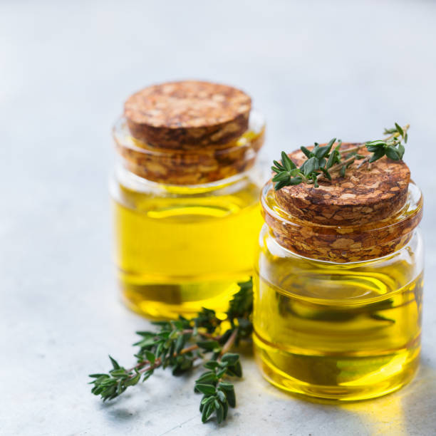 istock Organic essential thyme oil with green leaves 859079854