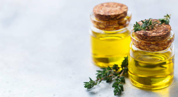 istock Organic essential thyme oil with green leaves 859079900