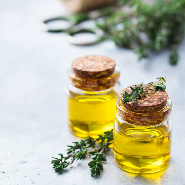istock Organic essential thyme oil with green leaves 859079940