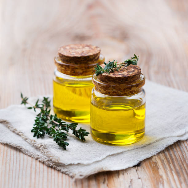 istock Organic essential thyme oil with green leaves 859080052