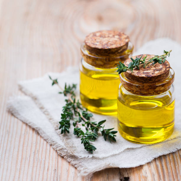 istock Organic essential thyme oil with green leaves 859080152