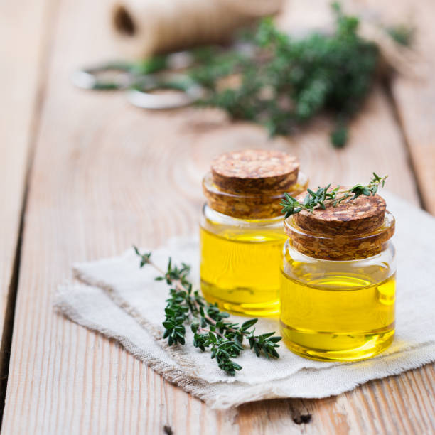 istock Organic essential thyme oil with green leaves 859080204