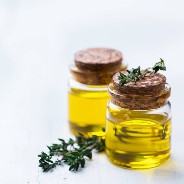 istock Organic essential thyme oil with green leaves 859080250
