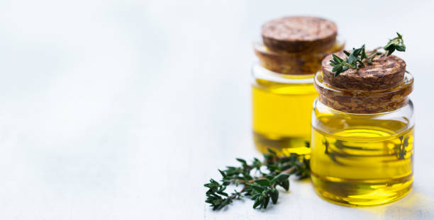 istock Organic essential thyme oil with green leaves 859080308
