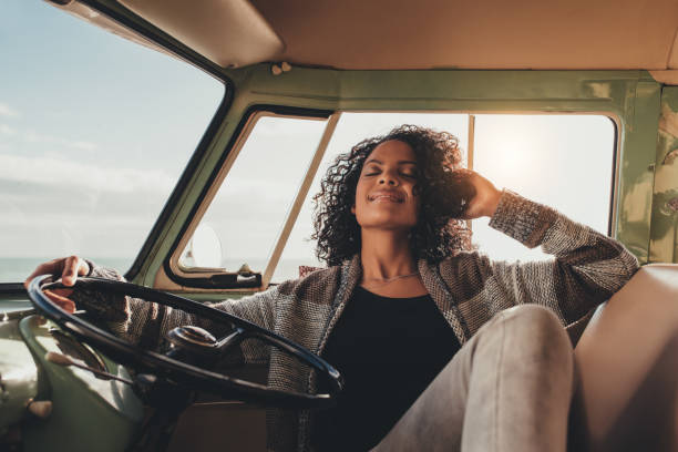 istock Woman on road trip taking rest in the van 859080344