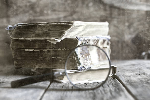 istock old scratched effect on photo magnifying glass and old book 859083508