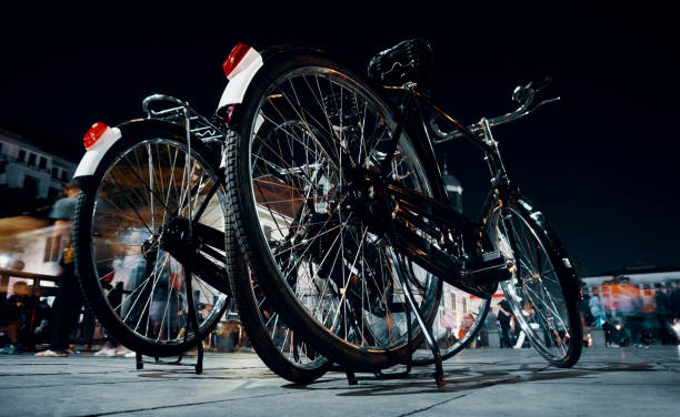 three old bicycle at yard of museum at night
