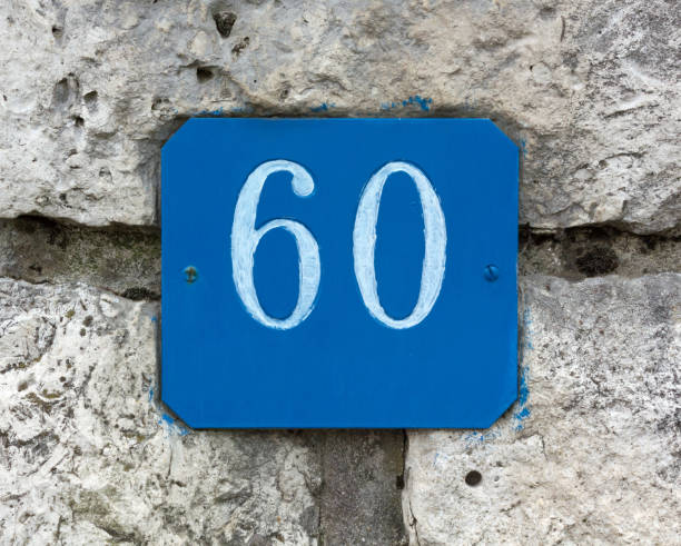 istock Street Number 60 on a Stone Wall 859087014
