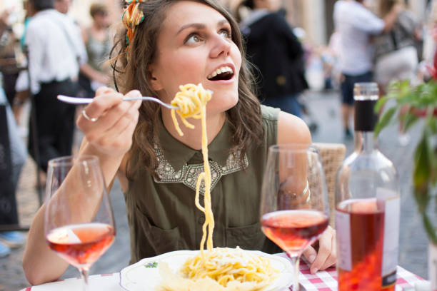 istock Woman With Forkful of Spaghetti 859087640
