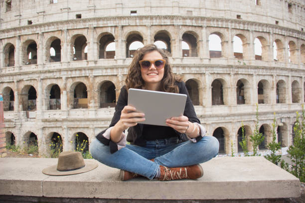 Smiling woman in front of Colosseum