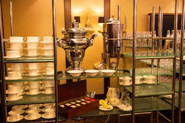 A samovar and a coffee. Self-catering in the banquet hall. Tea, coffee, banquetware