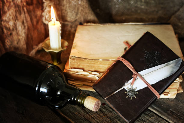 istock diary and feather with a bottle of rum 859097538
