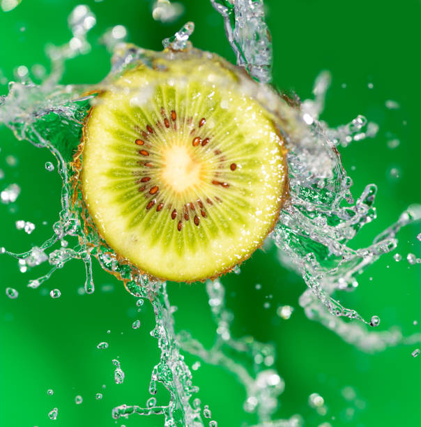 istock Kiwi in water on a green background 859102534