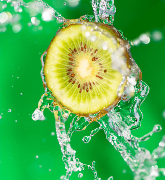 istock Kiwi in water on a green background 859102666