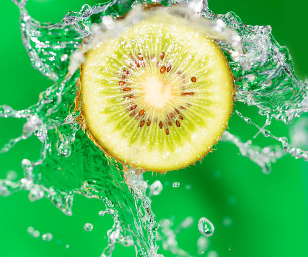 istock Kiwi in water on a green background 859102744
