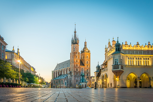 Sunrise over the main square in Krakow with the Basilica of Saint Mary and the town hall, Poland, 15 September, 2017