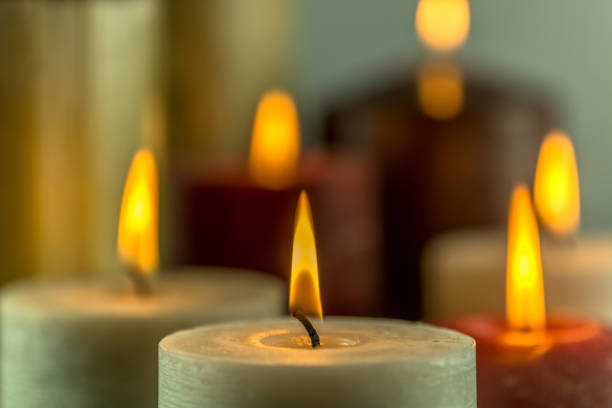 istock Many burning candles in different colors with a blurry background 859108046